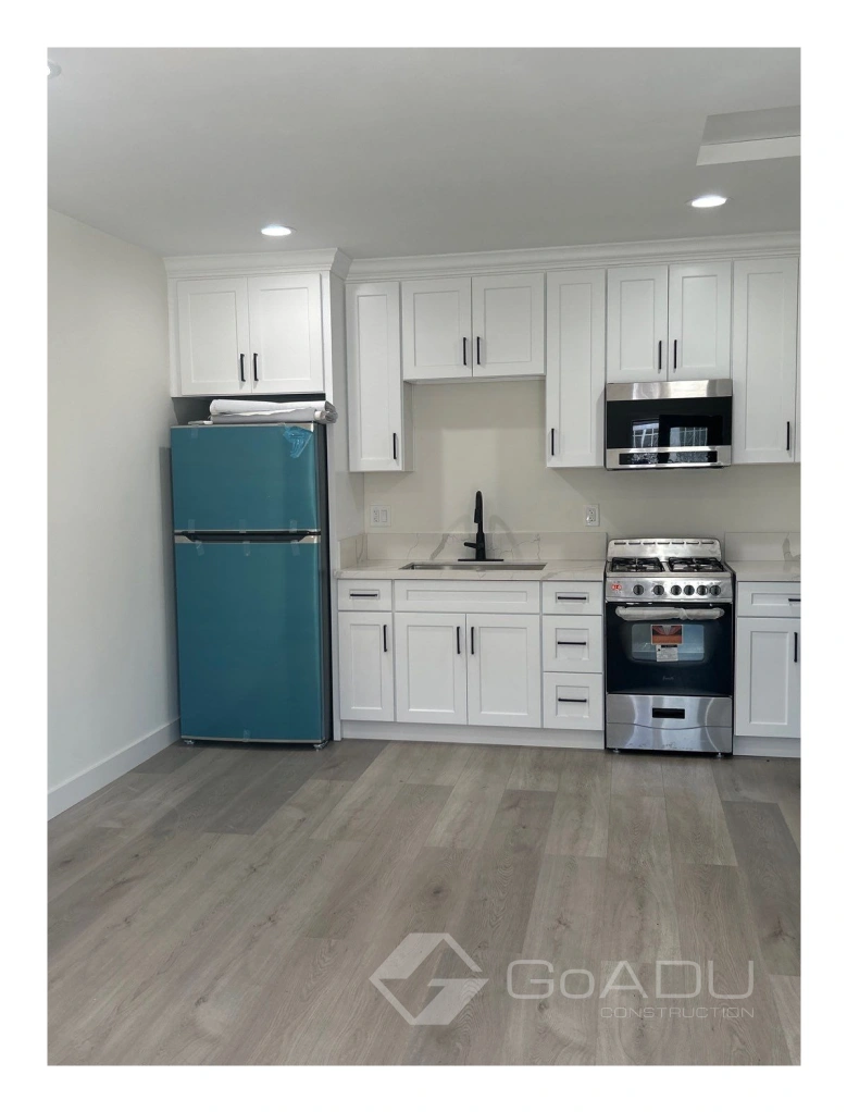 Custom adu kitchens in los angeles with modern appliances and white cabinetry.